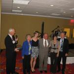 Barbara Dayney with family accepting Lifetime Achievement Award